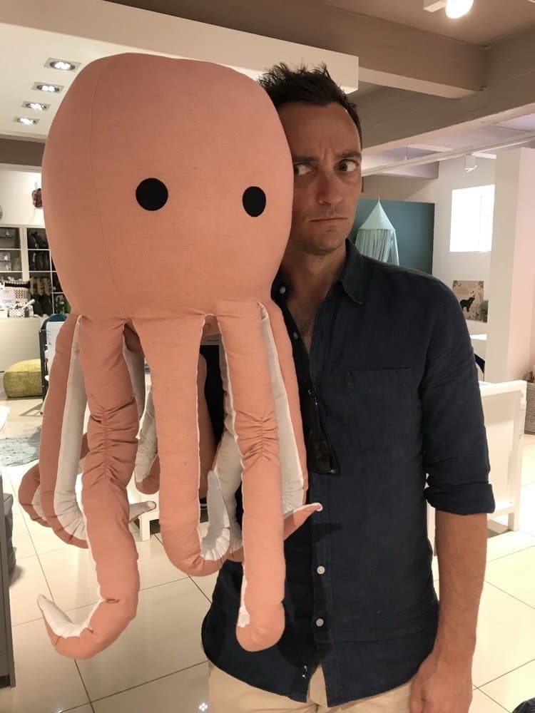 Holding a giant stuffed octopus